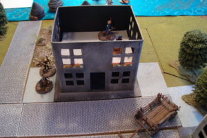 With Two Buildings Captured, Defenders In East Two-Story Building Await the Onslaught.